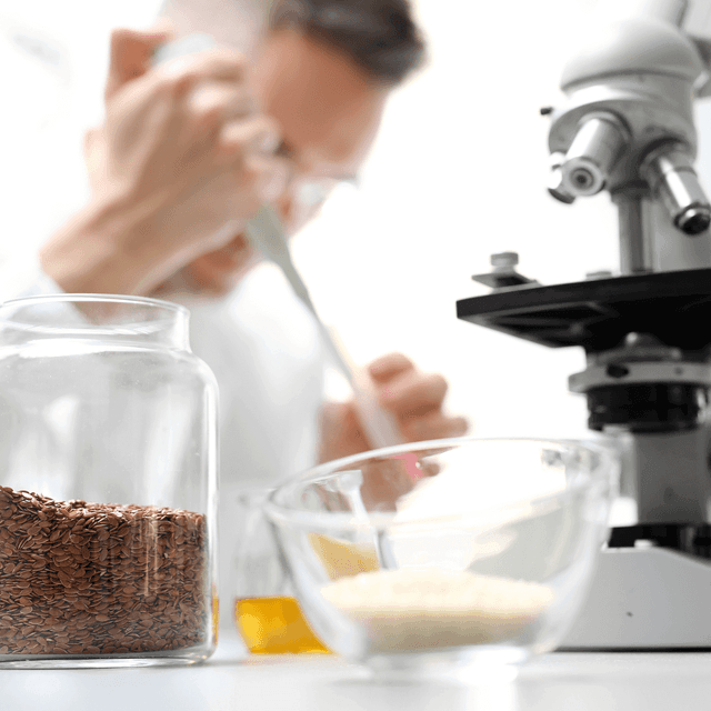 The lab technician analyzes the microscope in the laboratory.