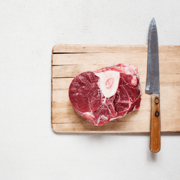 Raw meat beef steak on wooden cutting board